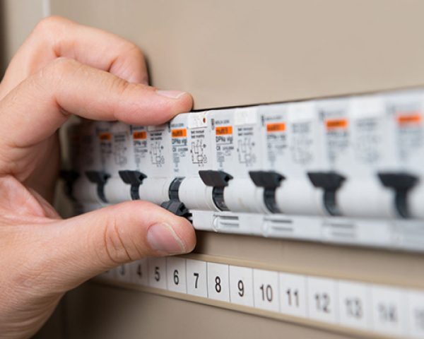 33251271 - closeup of person's hand repair the switchboard